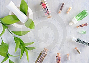 Elements of alternative medicine on a wooden background