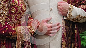 Elements of Beautiful woman dressed in traditional Indian hindu wedding. Couple standing together. Close up