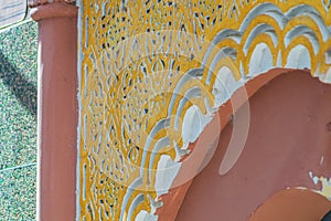 Elements of designer decoration of exterior parts of houses on streets of the city of Tangier in the Kingdom of Morocco