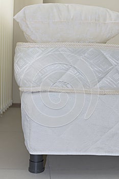 elements of a double bed frame with soft mattress cover