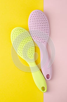 Elements of hair care. Colorful Hairbrushes for scalp massage