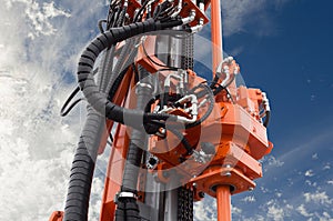 Elements of Hydraulic crawler oil drill machine on blue sky