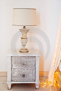 Elements of interior. vintage bedside table with table lamp