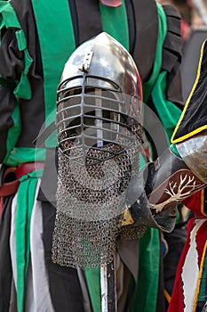 Elements of medieval iron knight armor for battle, helmet, spaulders, pouldrons, vambraces, gauntlets