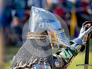 Elements of medieval iron knight armor for battle, helmet, spaulders, pouldrons, vambraces, gauntlets