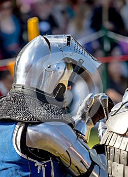 Elements of medieval iron knight armor for battle, helmet, spaulders, pouldrons, vambraces, gauntlets photo