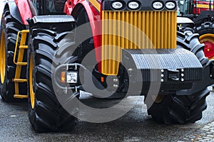 Elements of a red tractor, combine harvester close-up. Red tractor.New red tractor