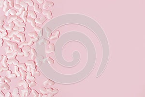 Elements in shape of heart flying on pink background. symbols of love for Happy Women`s, Mother`s, Valentine`s Day