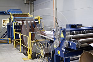 Elements of various sections of the galvanized steel processing line in rolls