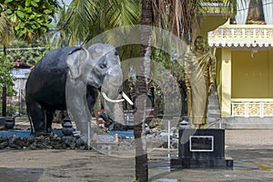 An elephant and Buddha statue stand at the Nagadipa Vihara on Nainativu Island in Sri Lanka.