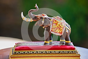 An elephant doll dressing with Thai kingdom tradition accessories.