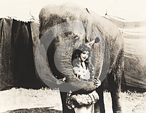 Elephant embracing circus performer