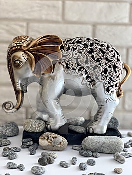 Elephant figurine, metal statuette, silver-gold elephant.