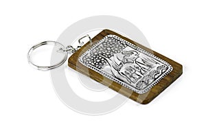 Elephant keychain on wood isolated on white background