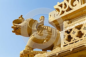 Elephant sculpture with a blind man on the Jian temple Amar Sagar, Jaisalmer area in Rajasthan, India