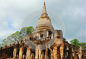 Elephant statue around pagoda at temple, Thailand