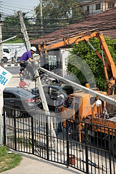 Eletrican climb on old broken power pole