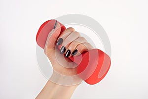 Elevate Your Fitness: Red Dumbbell in Young Female Hand