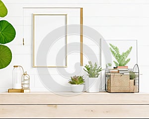 Elevate Your Interior Design with our Horizontal Metal Frame Poster Mock-Up, Featuring Succulents and Book.