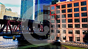 Elevated `el` train speeds over the Lake Street bridge, crossing the Chicago River in the Loop.