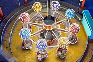 Elevated illuminated air balloon carousel indoor playground