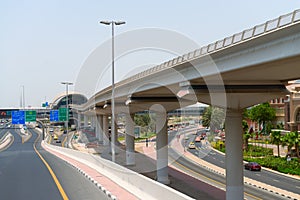 Elevated, monorail train track along a major metropolitan highway