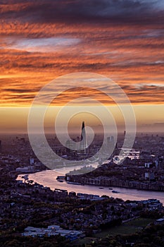 Elevated sunset view of the London skyline with Tower Bridge and River Thames