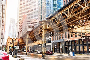 Elevated train on a tacks running over a street in Chicago Loop district