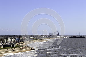 Elevated view of the incoming tide with blackpool pleasure beach in the distance photo