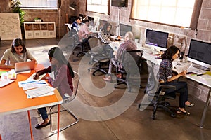 Elevated View Of People Working In Modern Design Office