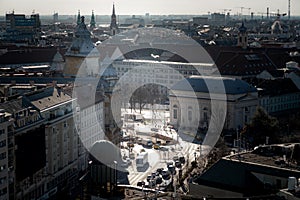 Elevated view of road junction with city traffic in winter