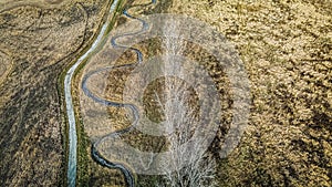 Elevated view of spiraling river with walking trail