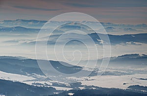 Sunny winter scenery with blue ridges and hazy valleys Slovakia