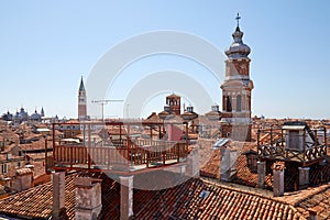 Elevated view of Venice roofs with typical altana balcony in Italy