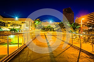 Elevated walkway and the Convention Center at night in Baltimore