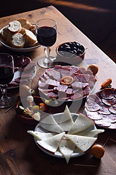 Elevated wiew wine and food on wooden table