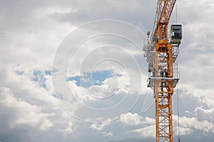 Elevating crane and sky with clouds