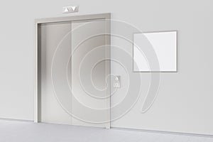 Elevator and blank poster or billboard in the modern office lobby