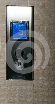 Elevator buttons on lift control panel at mall, hotel or business center - close up view - nobody, no people. Technology,