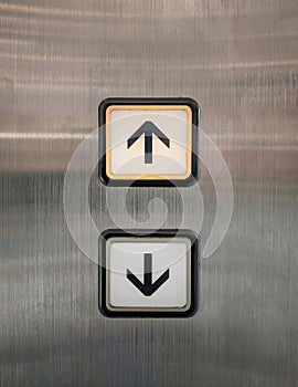 Elevator buttons for up and down with arrows.