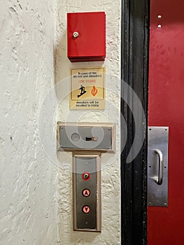 Elevator call buttons and protective steel door