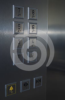 Elevator control panel, stainless steel finish, seven floors