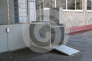 The elevator for disabled people vertical street at an entrance to the building