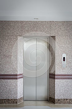 elevator door and granite wall