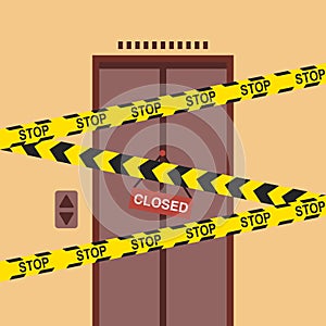 The elevator doors are closed with warning tape and a Closed sign