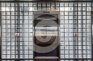 Elevator doors in a glass wall