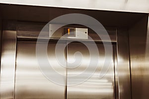 Closed door of the lift. Elevator on the first floor.
