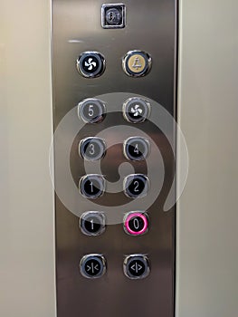 Elevator lift numbers interior for transportation inside a facility or a hotel with one number with red light selected