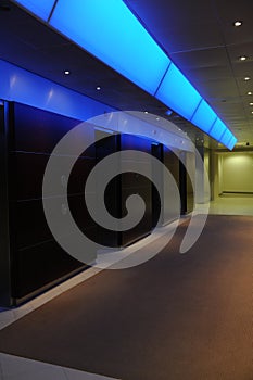 Elevators in office building with blue light accen