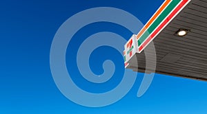 7 eleven logo in front of the clear blue sky